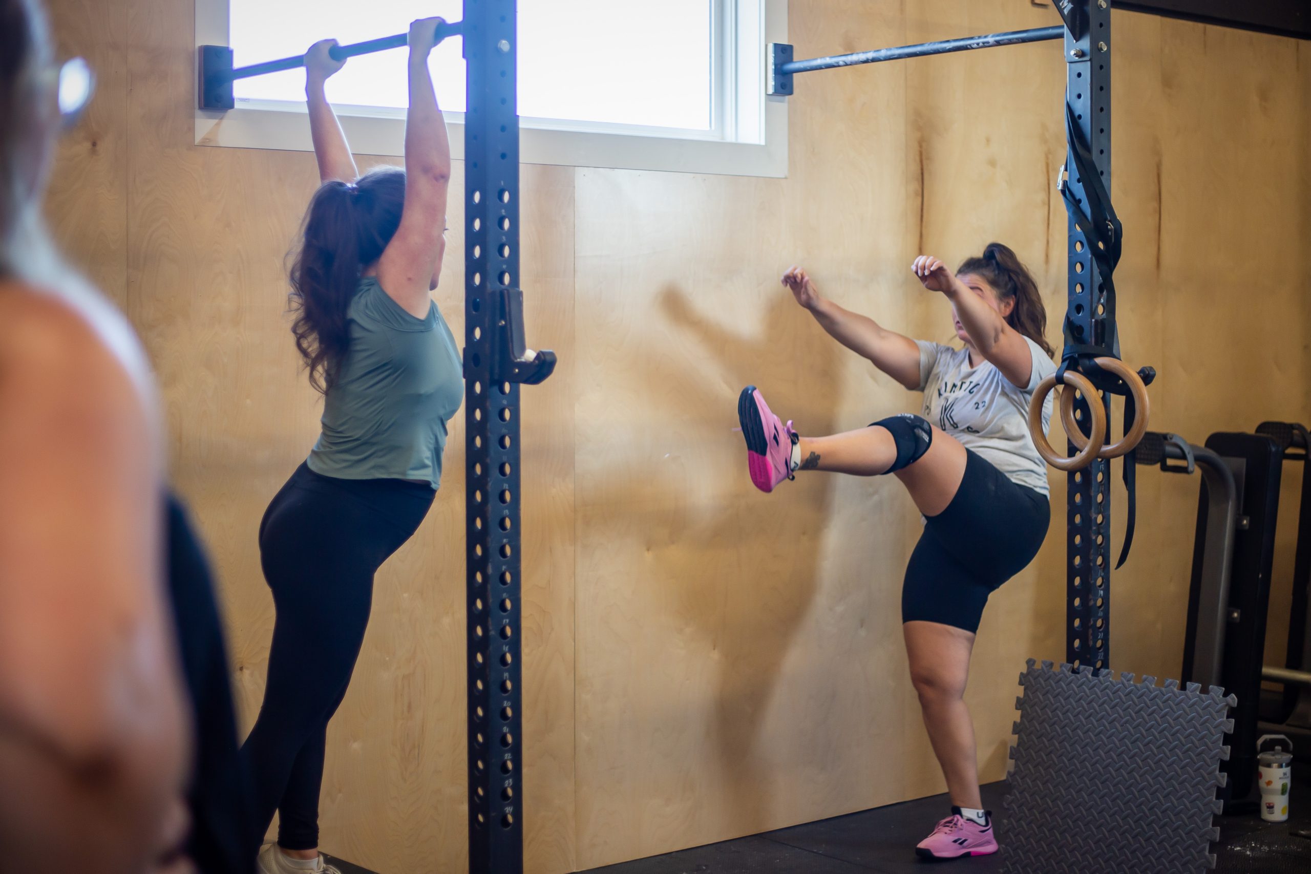 Kinetic-57 Coach demonstrating exercise to athlete